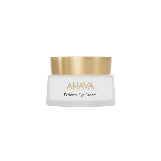 Jar of AHAVA Extreme Firming Eye Cream with frosted glass, dark lid, and label visible on a neutral background